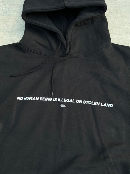 “No Human Being is Illegal on Stolen Land” Essential hoodie